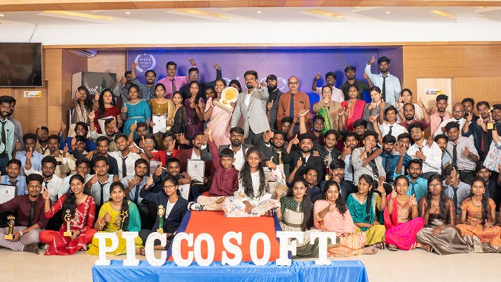 Team members posing together in office
